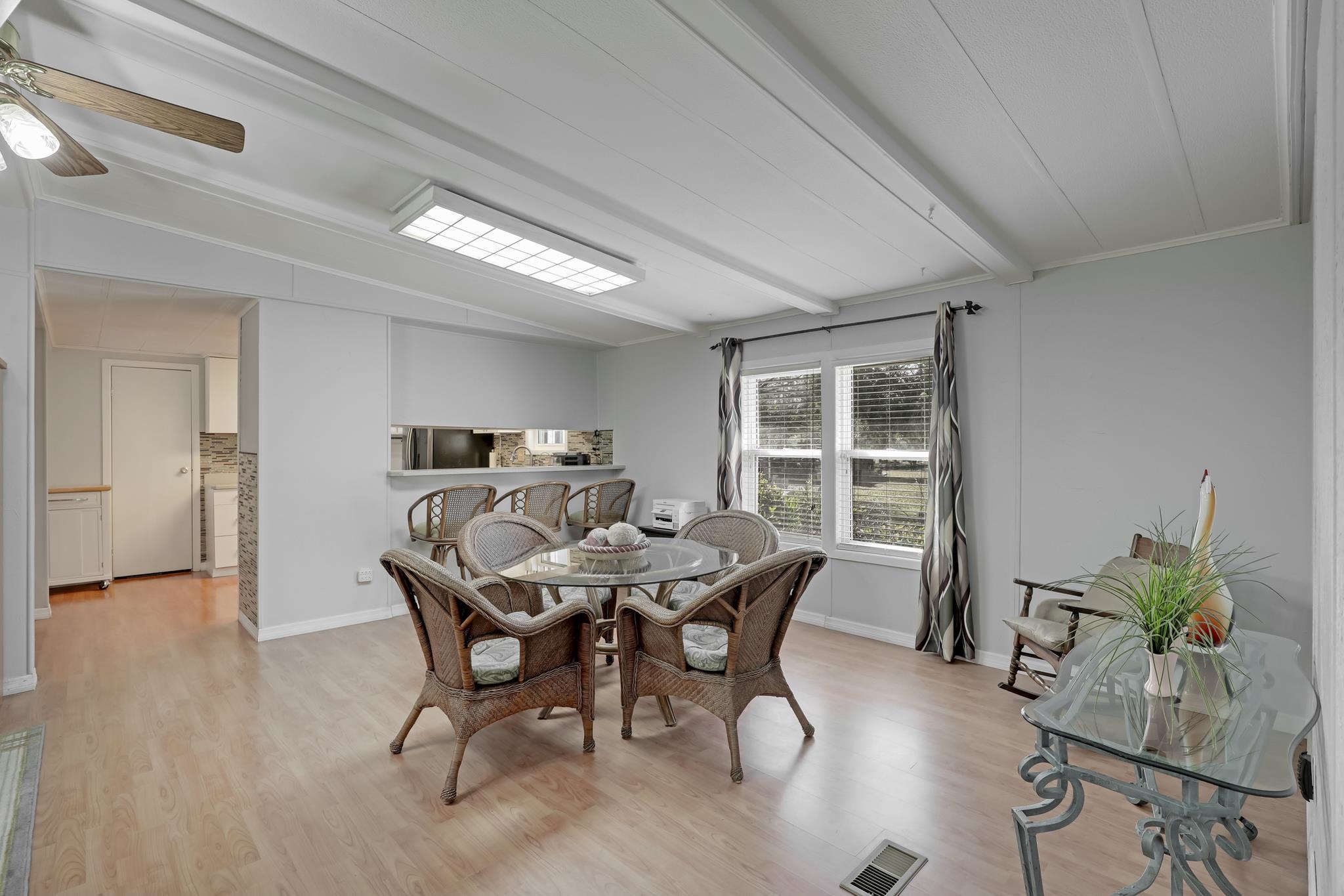 6901 Catlett Road St. Augustine, FL 32095 - Photo 25 of 74 Dining space with light wood-style floors, vaulted ceiling with beams, a ceiling fan, and crown molding