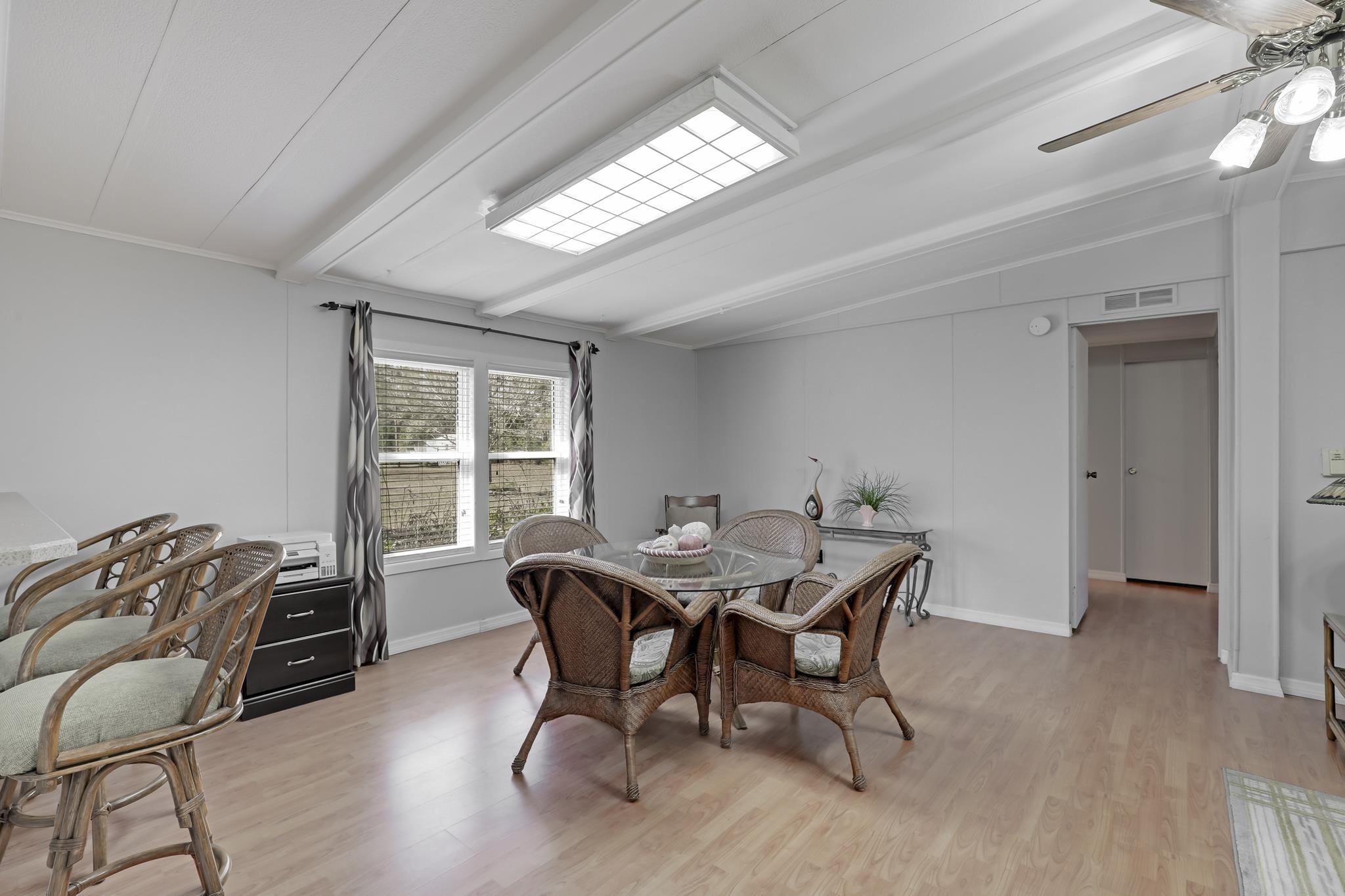 6901 Catlett Road St. Augustine, FL 32095 - Photo 26 of 74 Dining space with lofted ceiling with beams, light wood-style flooring, and a ceiling fan