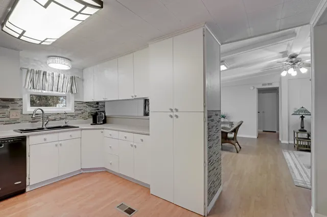 a view of a backyard with sitting area