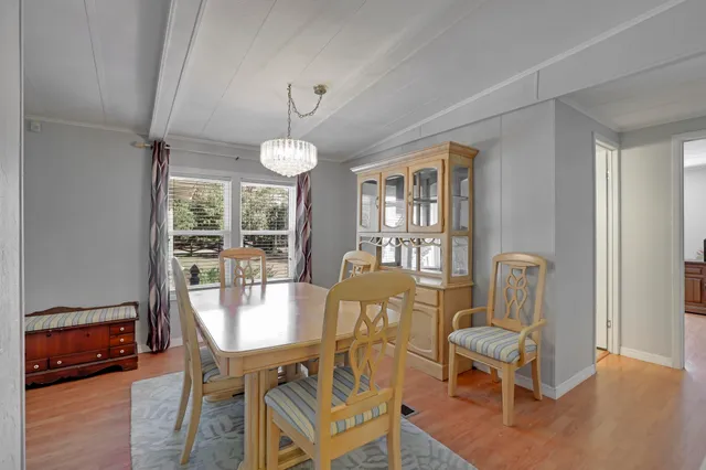 a swimming pool with an outdoor seating and yard