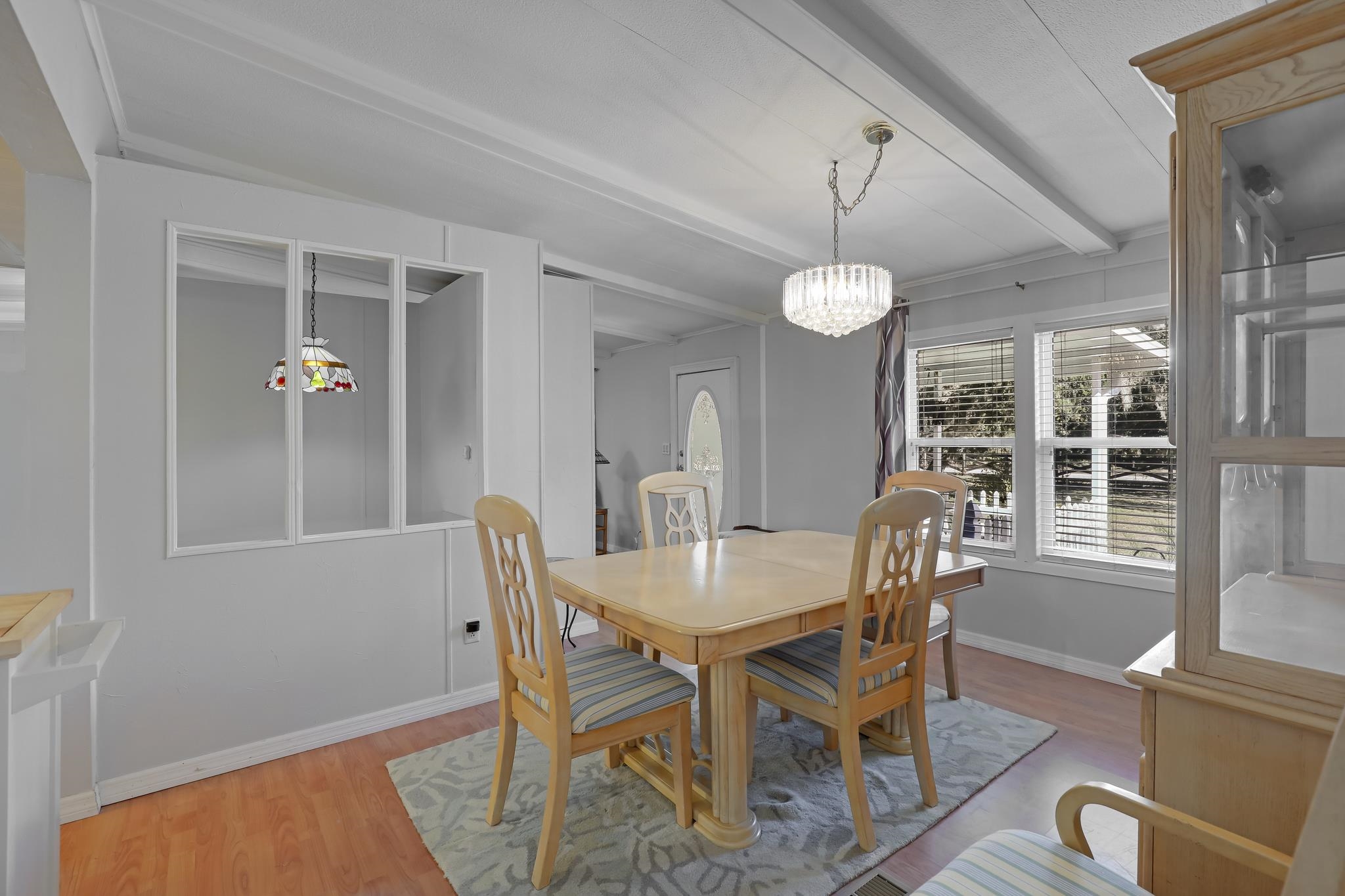 6901 Catlett Road St. Augustine, FL 32095 - Photo 39 of 74 Dining space with beam ceiling, light wood-type flooring, and suspended lighting