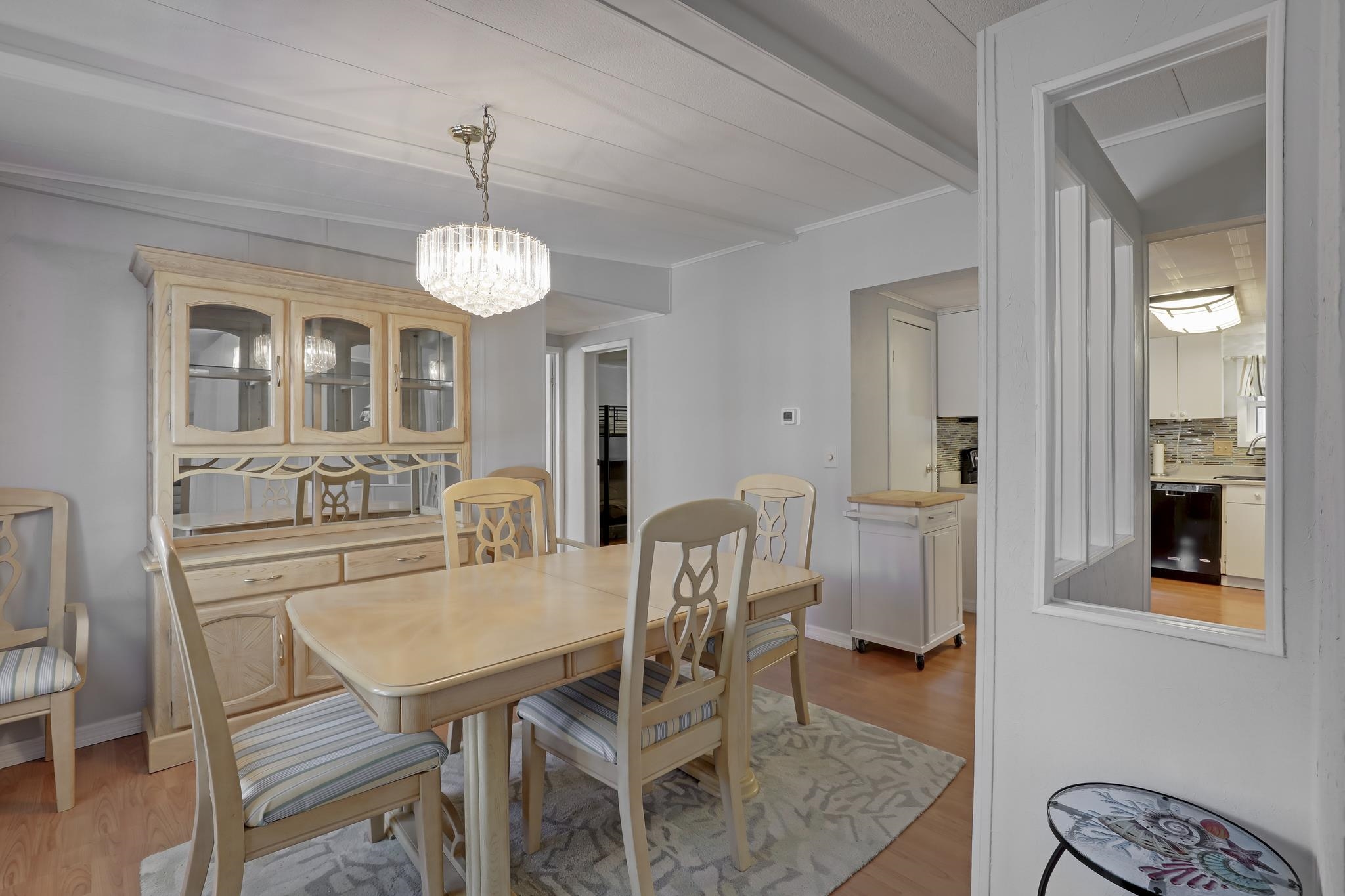 6901 Catlett Road St. Augustine, FL 32095 - Photo 40 of 74 Dining area featuring light wood-style floors, a chandelier, and ornamental molding