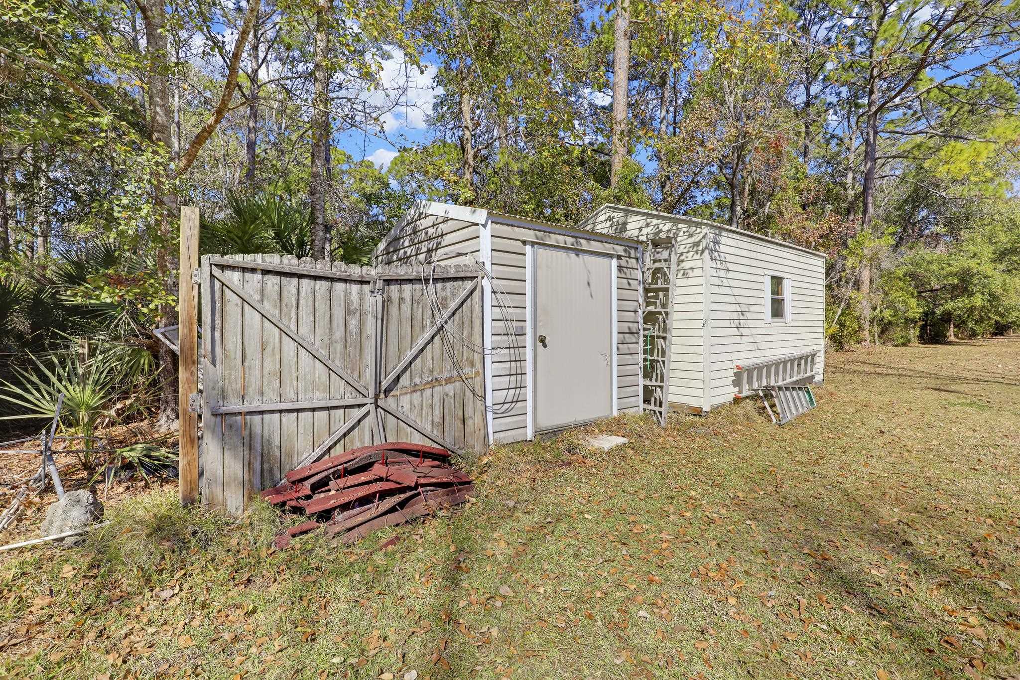 6901 Catlett Road St. Augustine, FL 32095 - Photo 61 of 74 View of shed featuring view of scattered trees
