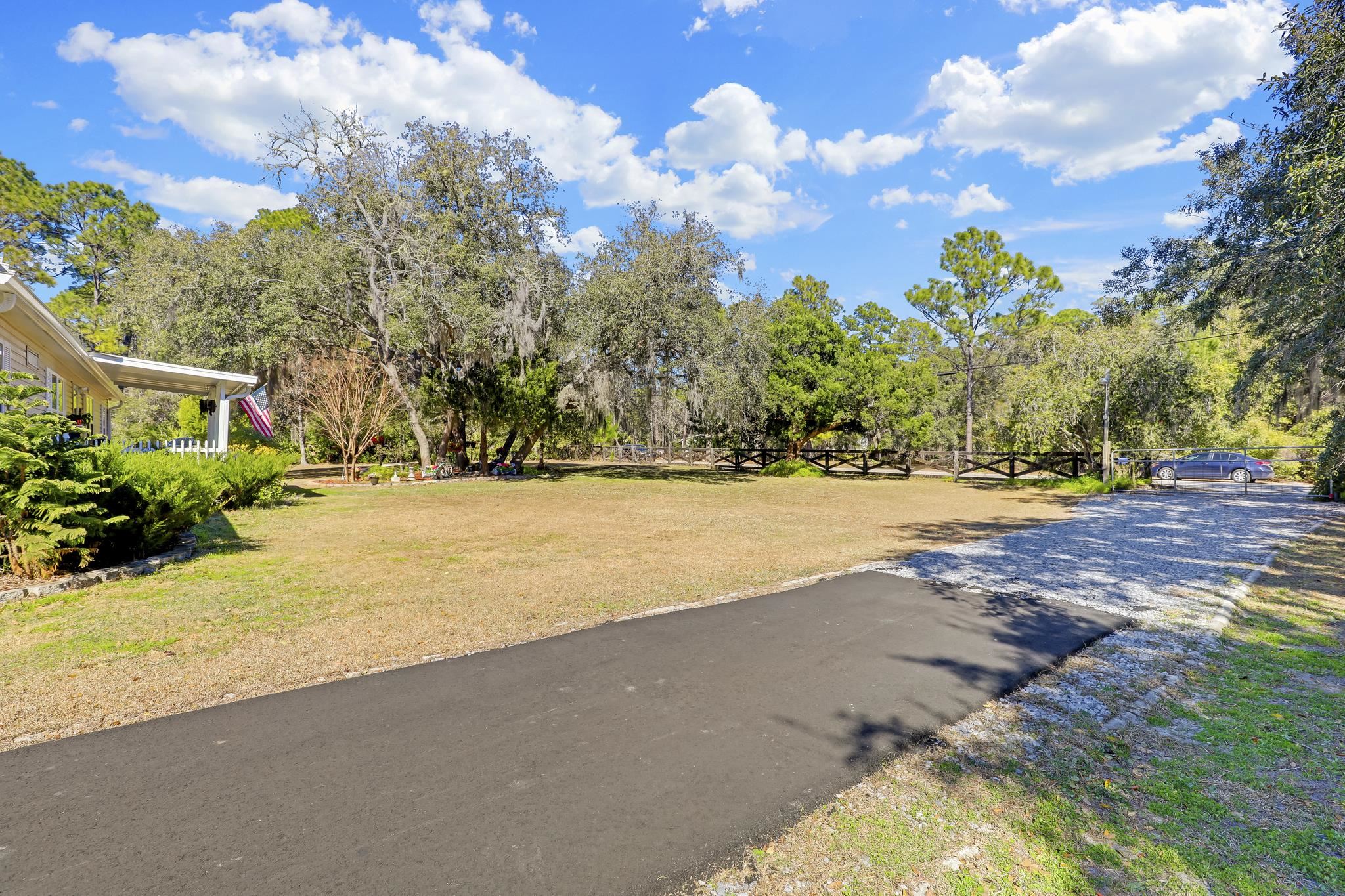 6901 Catlett Road St. Augustine, FL 32095 - Photo 65 of 74 View of asphalt road featuring view of scattered trees