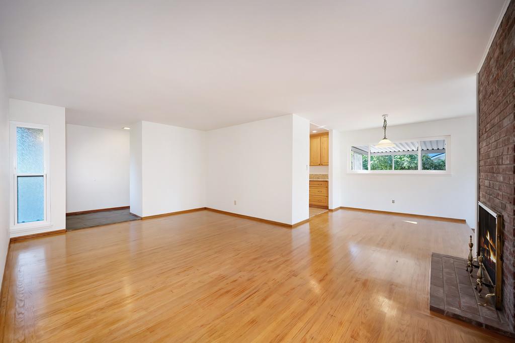1056 Entrada Road Sacramento, CA 95864 - Photo 11 of 57 a view of a room with wooden floor and a ceiling fan
