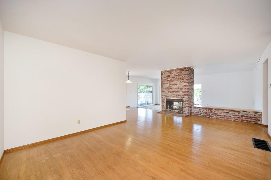1056 Entrada Road Sacramento, CA 95864 - Photo 12 of 57 a view of empty room with wooden floor