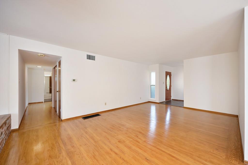1056 Entrada Road Sacramento, CA 95864 - Photo 14 of 57 a view of empty room with wooden floor