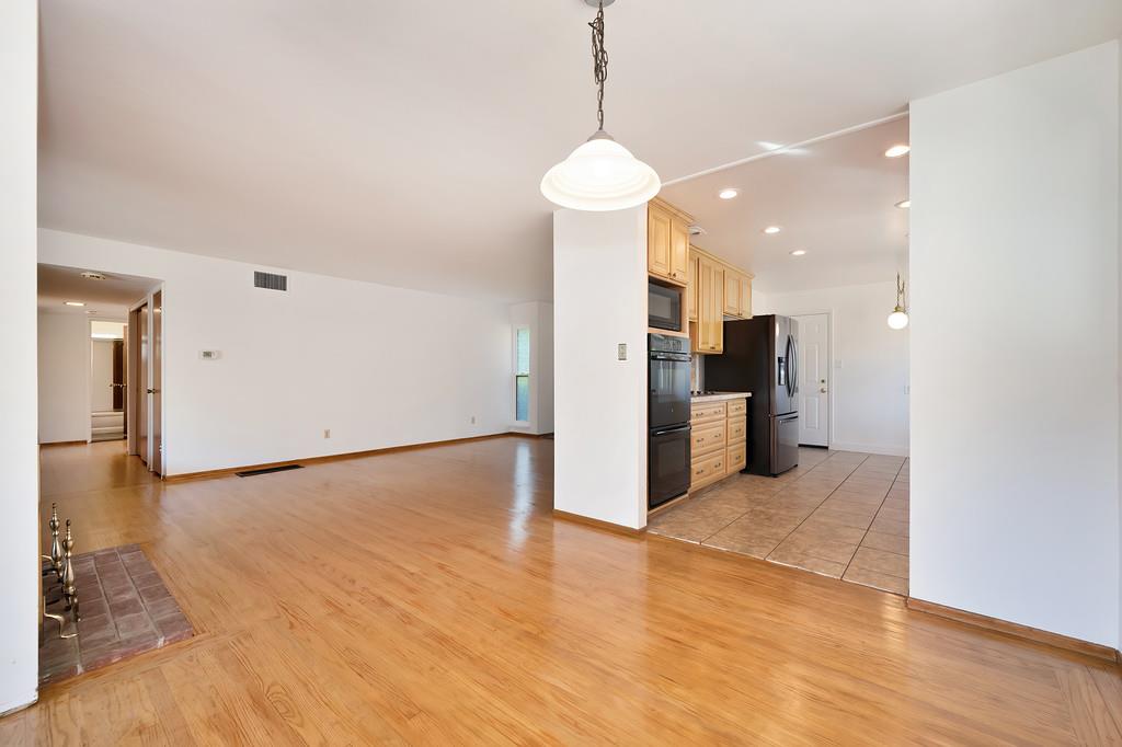 1056 Entrada Road Sacramento, CA 95864 - Photo 15 of 57 a view of a kitchen with a refrigerator and a stove top oven