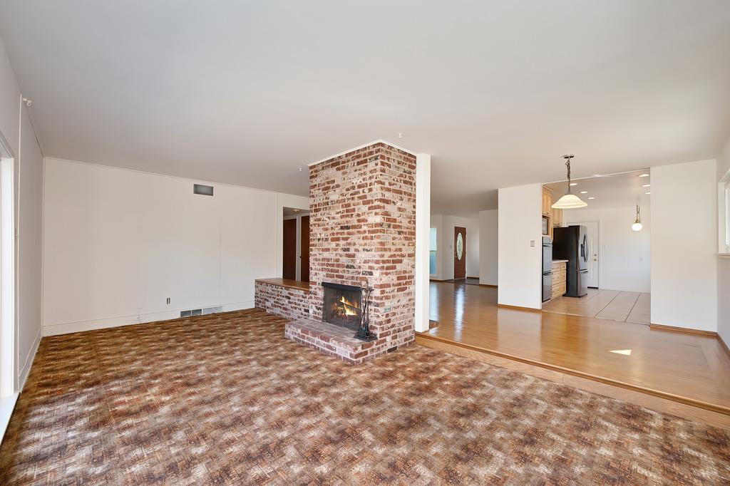 1056 Entrada Road Sacramento, CA 95864 - Photo 20 of 57 a view of livingroom with hardwood floor and a fireplace