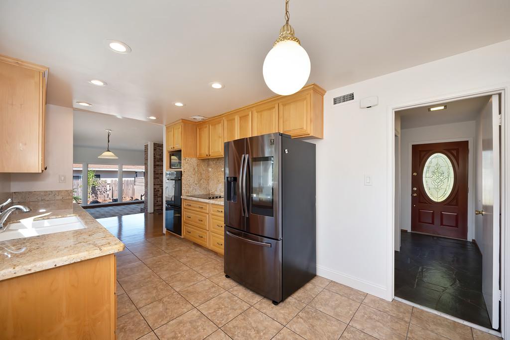 1056 Entrada Road Sacramento, CA 95864 - Photo 26 of 57 a kitchen with stainless steel appliances granite countertop a refrigerator a stove and a sink