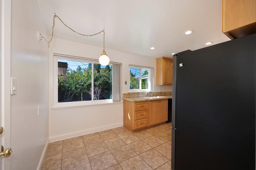 1056 Entrada Road Sacramento, CA 95864 - Photo 30 of 57 a large bathroom with a granite countertop sink mirror and a bathtub