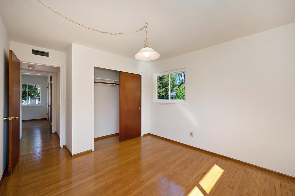 1056 Entrada Road Sacramento, CA 95864 - Photo 34 of 57 wooden floor in an empty room with a window