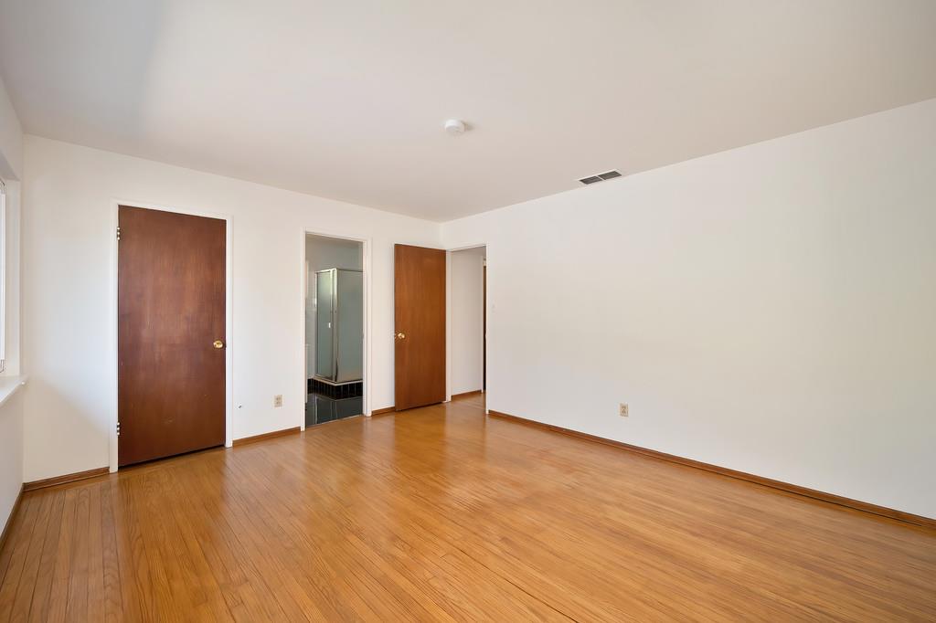 1056 Entrada Road Sacramento, CA 95864 - Photo 39 of 57 a view of an empty room with wooden floor