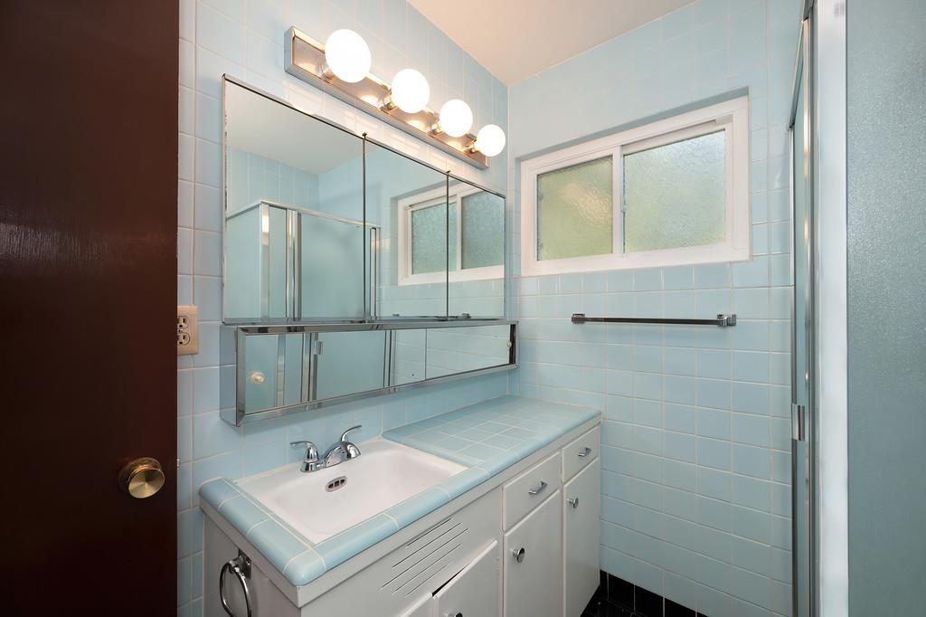 1056 Entrada Road Sacramento, CA 95864 - Photo 42 of 57 a bathroom with a sink and a mirror