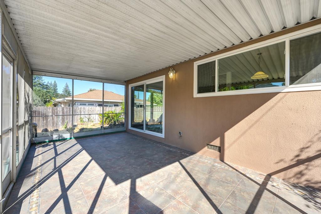 1056 Entrada Road Sacramento, CA 95864 - Photo 45 of 57 a view of balcony with a floor to ceiling window next to a yard