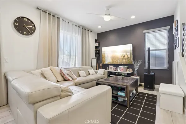 a living room with furniture and a large window
