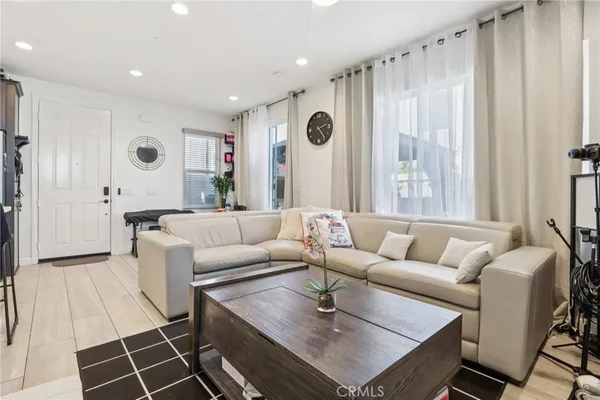 a kitchen with stainless steel appliances kitchen island granite countertop a refrigerator and a stove top oven
