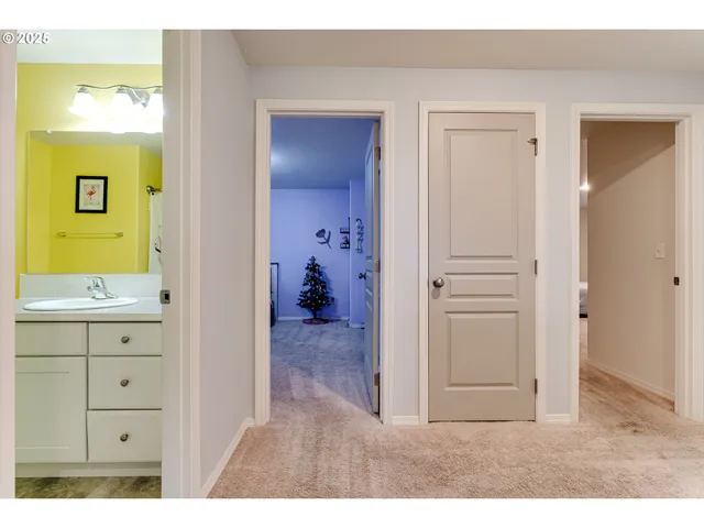 a bathroom with a granite countertop toilet sink and mirror