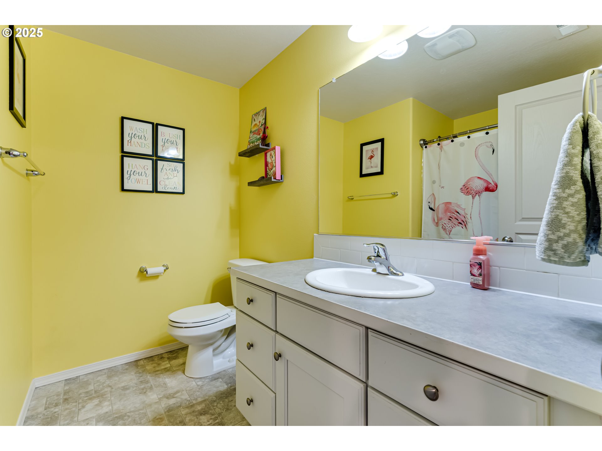 4685 Glacier Meadows Loop Springfield, OR 97478 - Photo 14 of 28 a bathroom with a granite countertop toilet sink and mirror