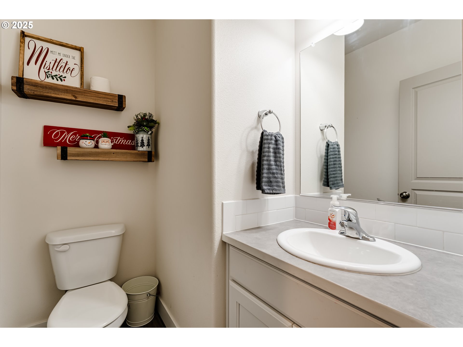4685 Glacier Meadows Loop Springfield, OR 97478 - Photo 2 of 28 a bathroom with a toilet a sink and a mirror