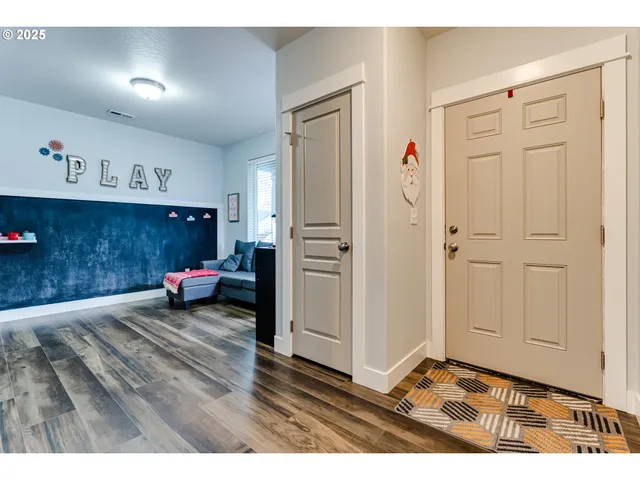 a backyard of a house with wooden floor and fence