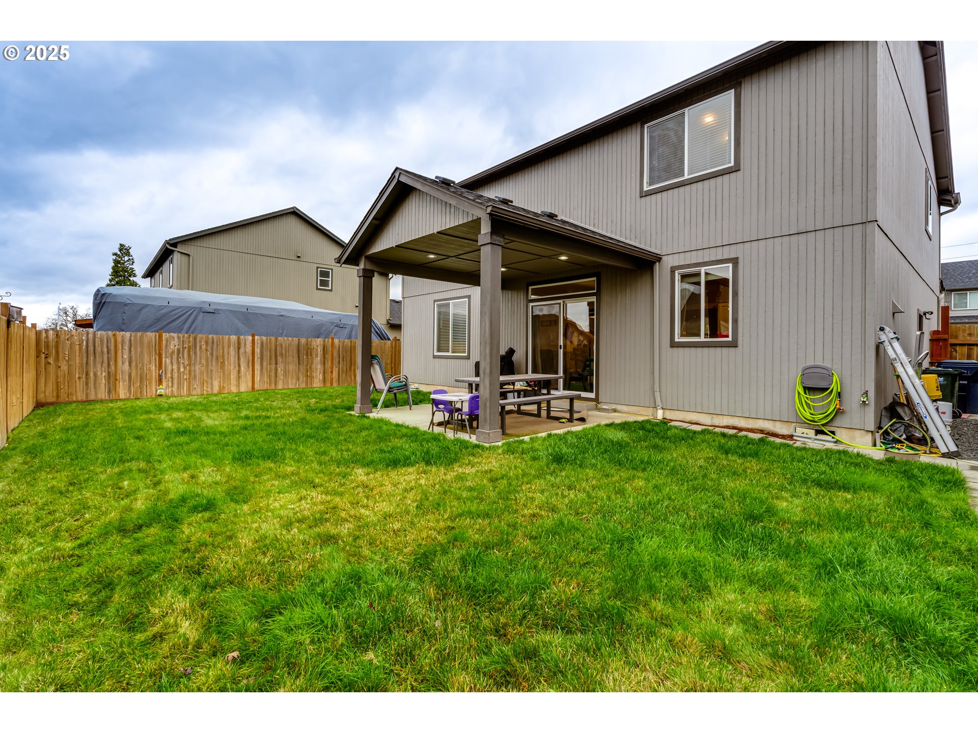 4685 Glacier Meadows Loop Springfield, OR 97478 - Photo 23 of 28 a view of a back yard of the house with a patio