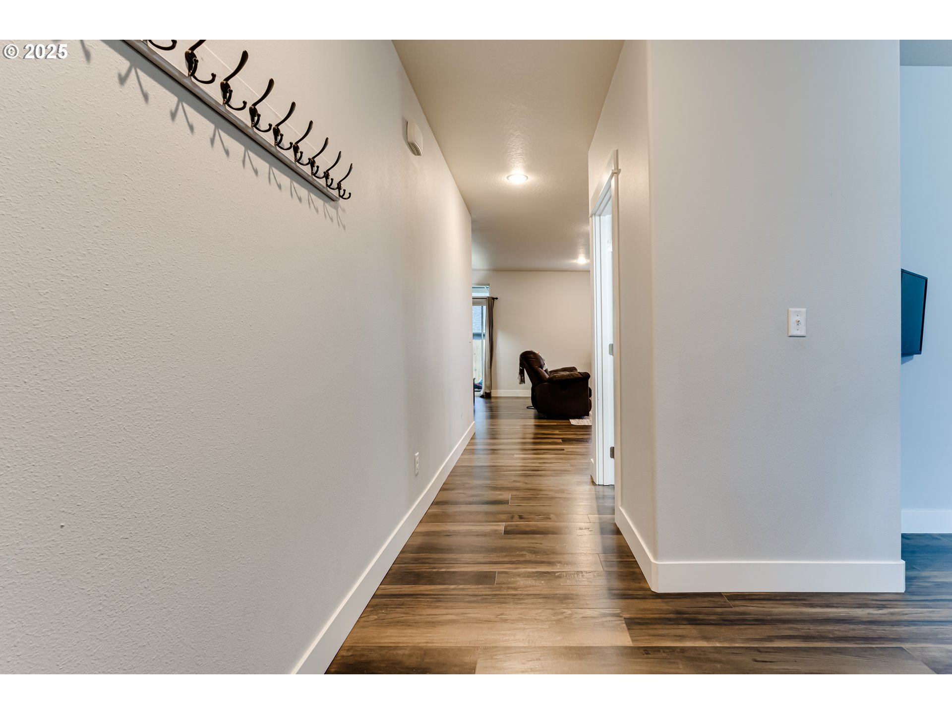 4685 Glacier Meadows Loop Springfield, OR 97478 - Photo 25 of 28 a hallway with wooden floor