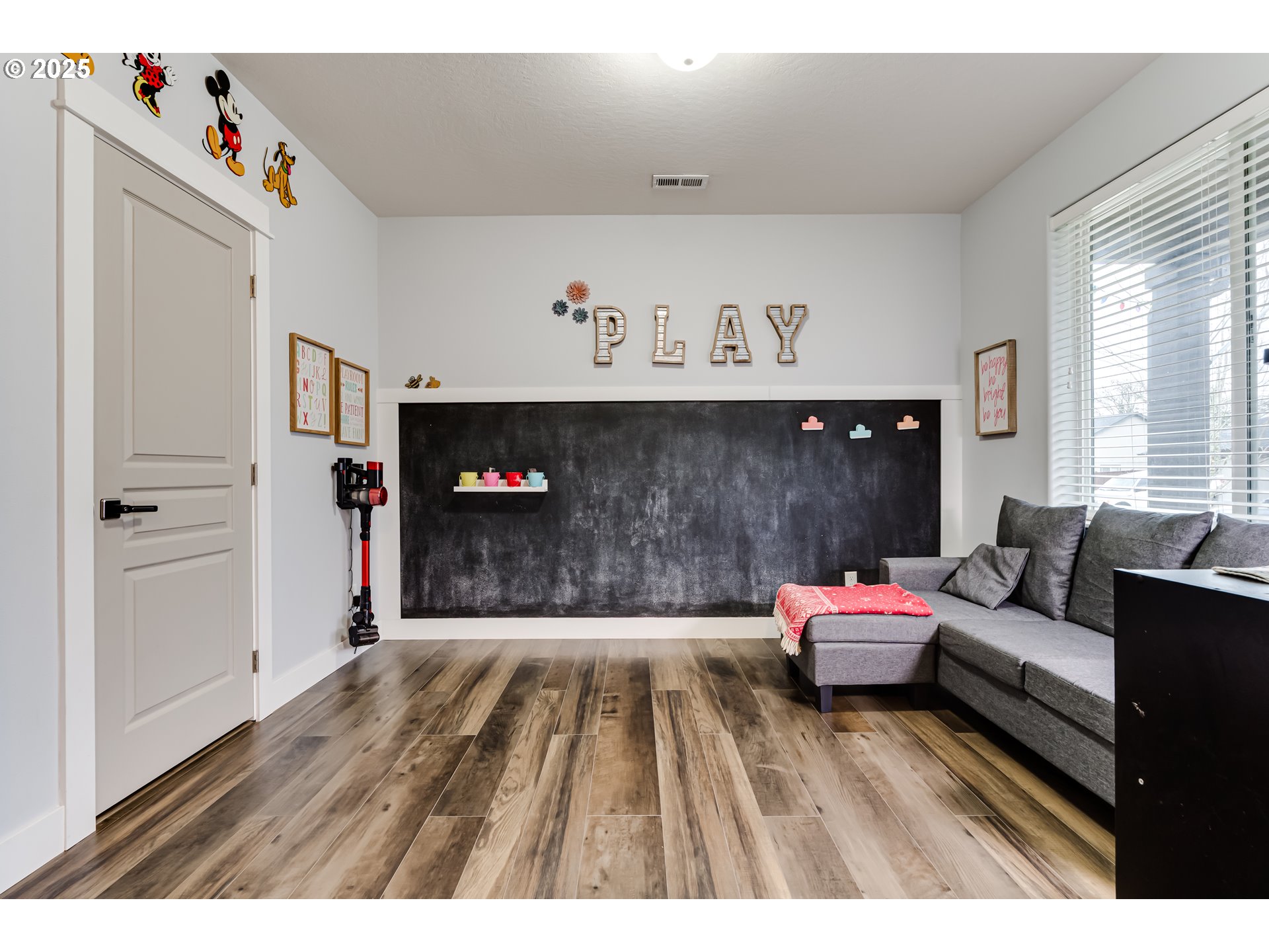 4685 Glacier Meadows Loop Springfield, OR 97478 - Photo 26 of 28 a living room with furniture and a flat screen tv