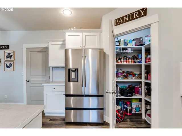 a kitchen with stainless steel appliances cabinets and a counter top space