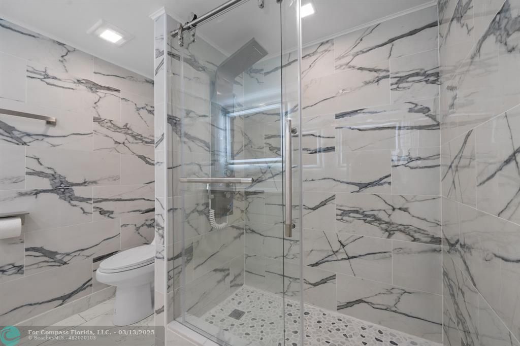 100 Golden Isles Drive, Unit 313 Hallandale Beach, FL 33009 - Photo 17 of 33 a bathroom with a shower