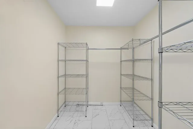 a view of an empty walk in closet