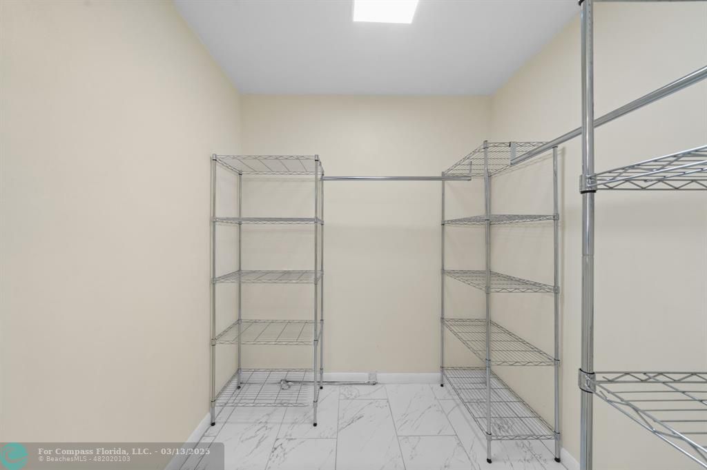 100 Golden Isles Drive, Unit 313 Hallandale Beach, FL 33009 - Photo 18 of 33 a view of an empty walk in closet