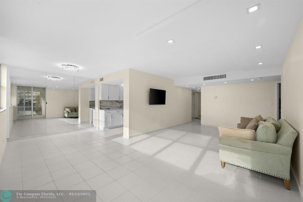 100 Golden Isles Drive, Unit 313 Hallandale Beach, FL 33009 - Photo 21 of 33 a living room with furniture and view of kitchen