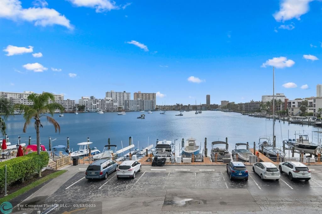 100 Golden Isles Drive, Unit 313 Hallandale Beach, FL 33009 - Photo 30 of 33 a view of a terrace with outdoor seating and city view