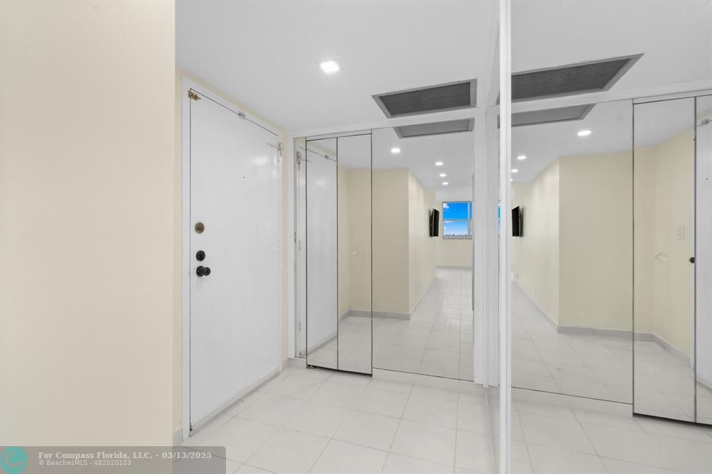 100 Golden Isles Drive, Unit 313 Hallandale Beach, FL 33009 - Photo 31 of 33 a bathroom with a glass shower door and a glass door