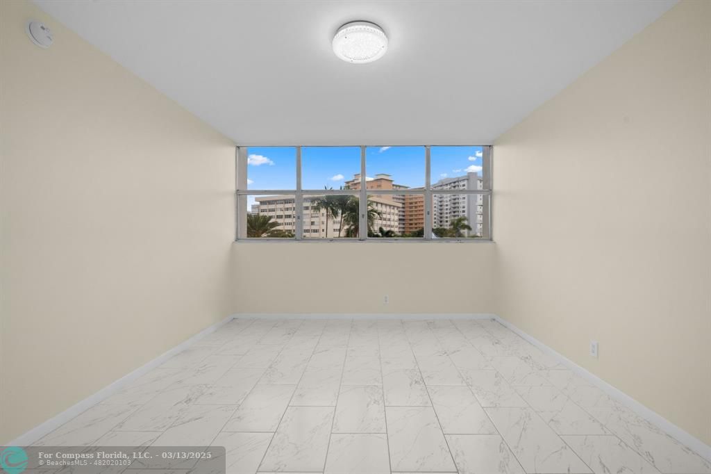 100 Golden Isles Drive, Unit 313 Hallandale Beach, FL 33009 - Photo 7 of 33 a view of kitchen and window