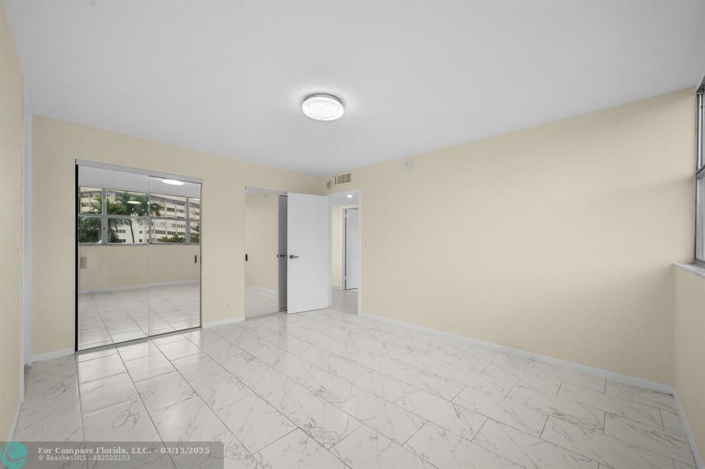 100 Golden Isles Drive, Unit 313 Hallandale Beach, FL 33009 - Photo 9 of 33 an empty room with a bathroom