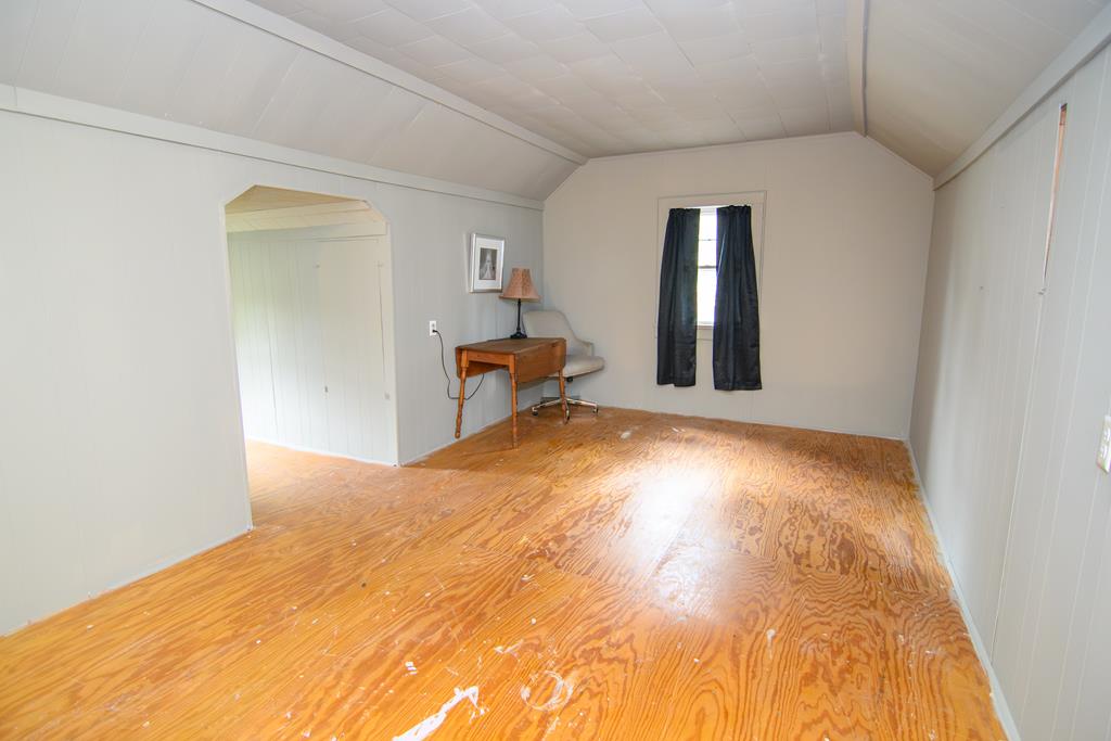 24432 Maxwell Street Parksley, VA 23421 - Photo 25 of 39 a view of empty room with wooden floor