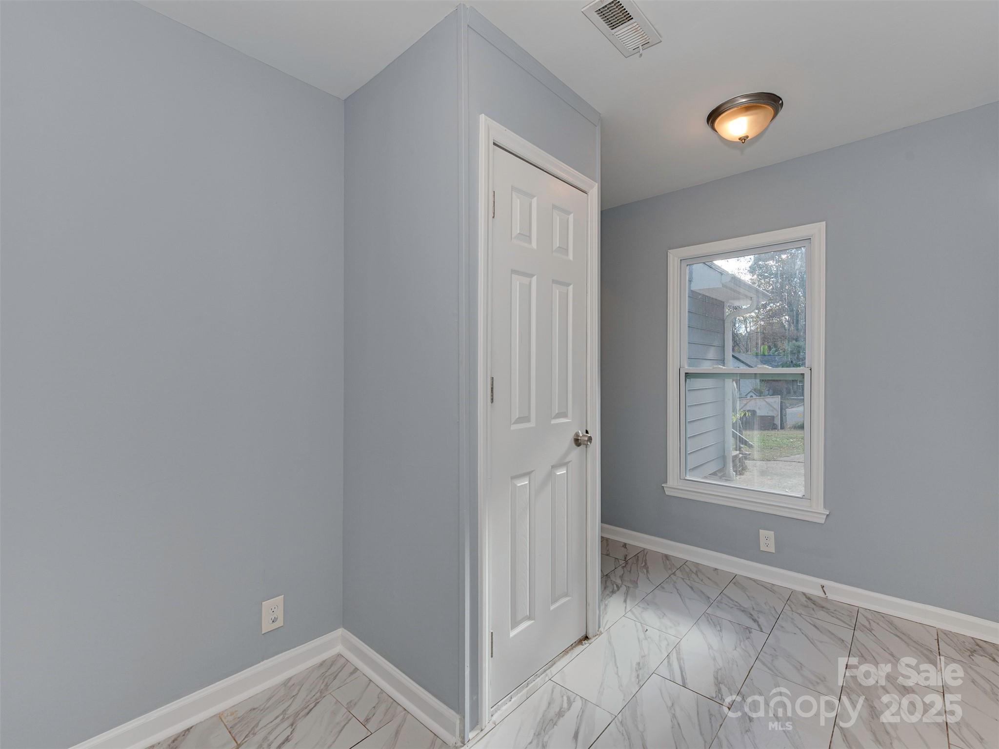 7413 Lockmont Drive Charlotte, NC 28212 - Photo 20 of 42 a view of an empty room and window