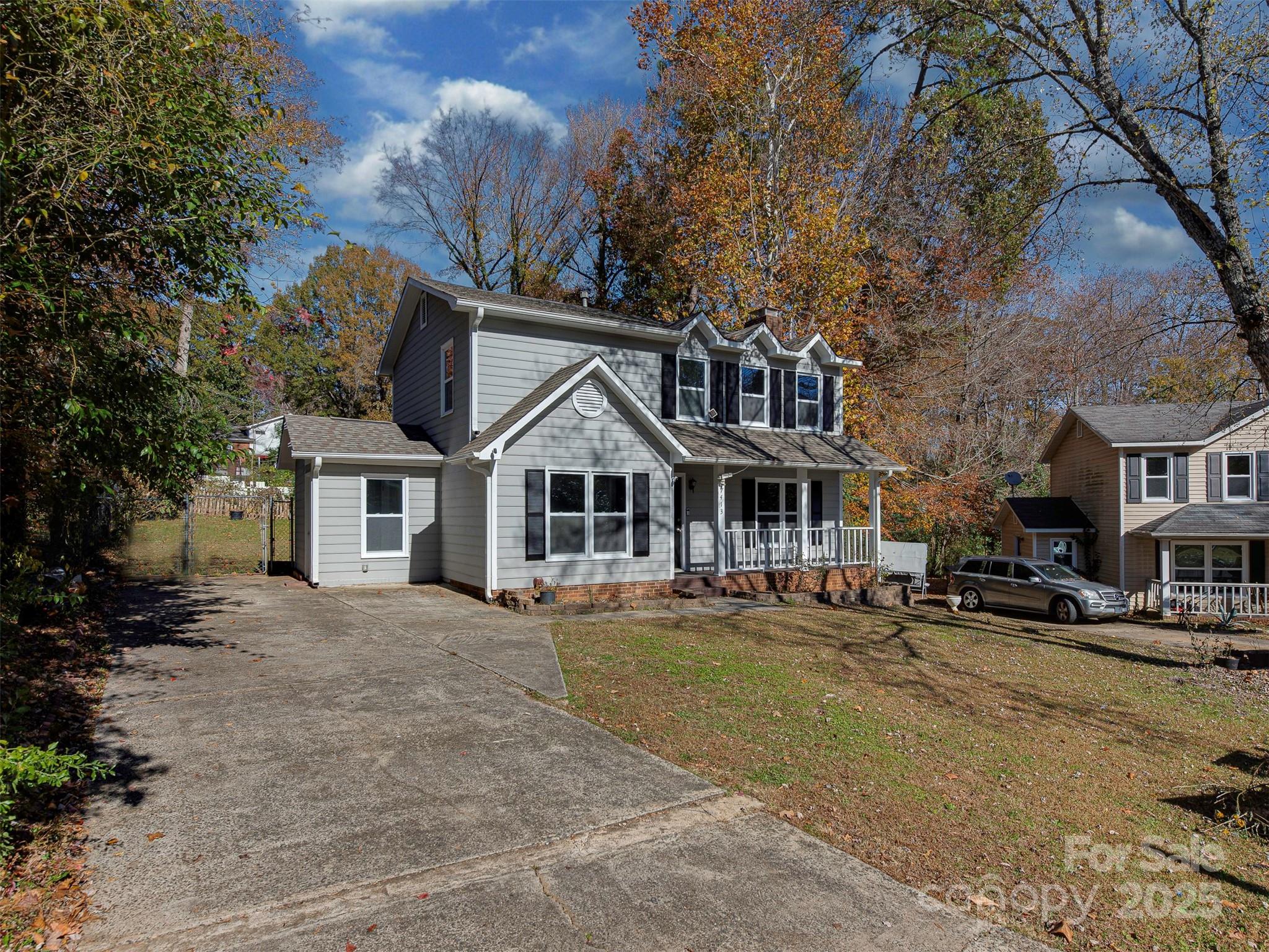 7413 Lockmont Drive Charlotte, NC 28212 - Photo 2 of 42 a front view of a building with lot of trees