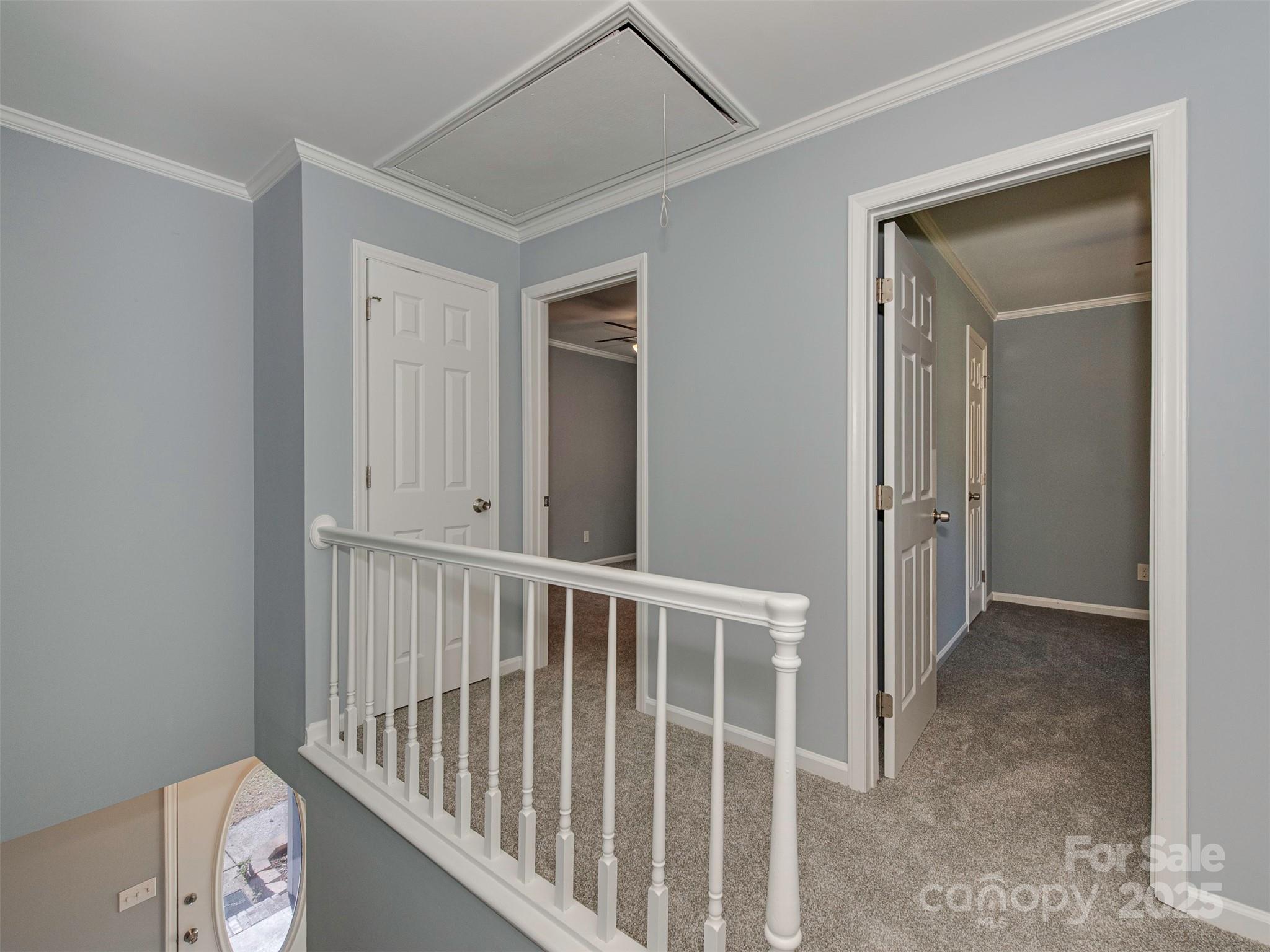 7413 Lockmont Drive Charlotte, NC 28212 - Photo 27 of 42 a view of a hallway with wooden floor and closet