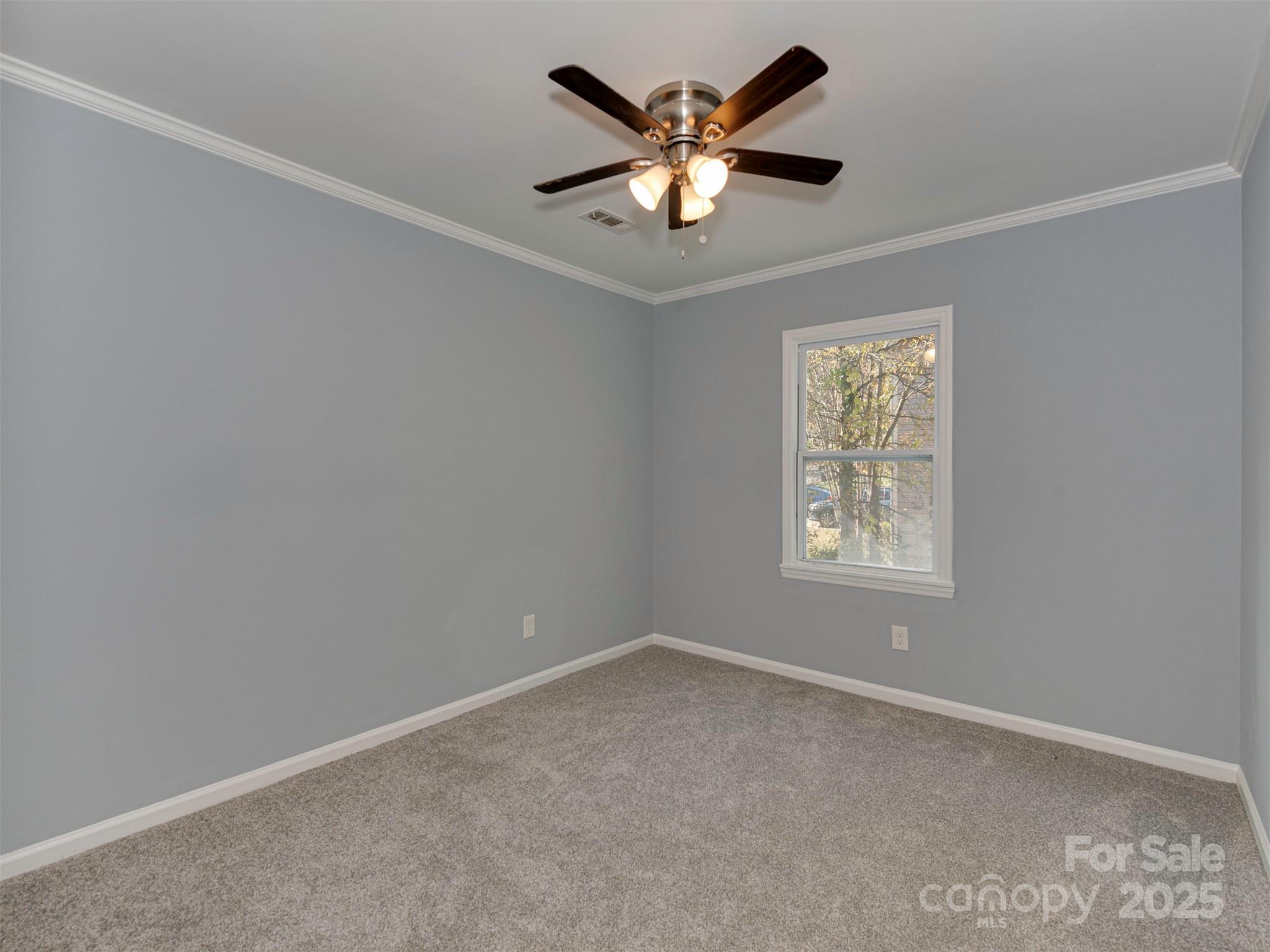 7413 Lockmont Drive Charlotte, NC 28212 - Photo 28 of 42 an empty room with a window
