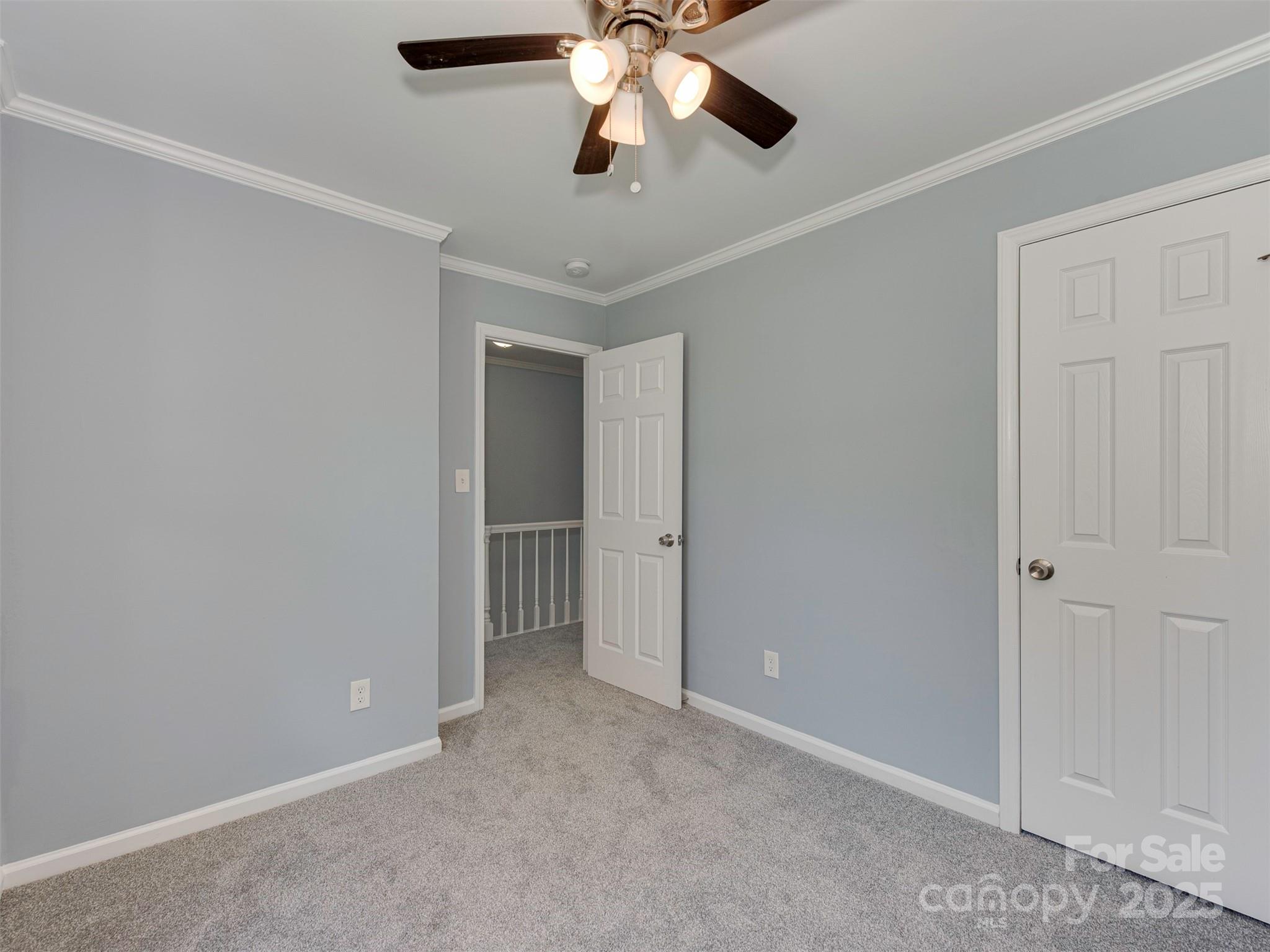 7413 Lockmont Drive Charlotte, NC 28212 - Photo 33 of 42 a view of an empty room and chandelier fan