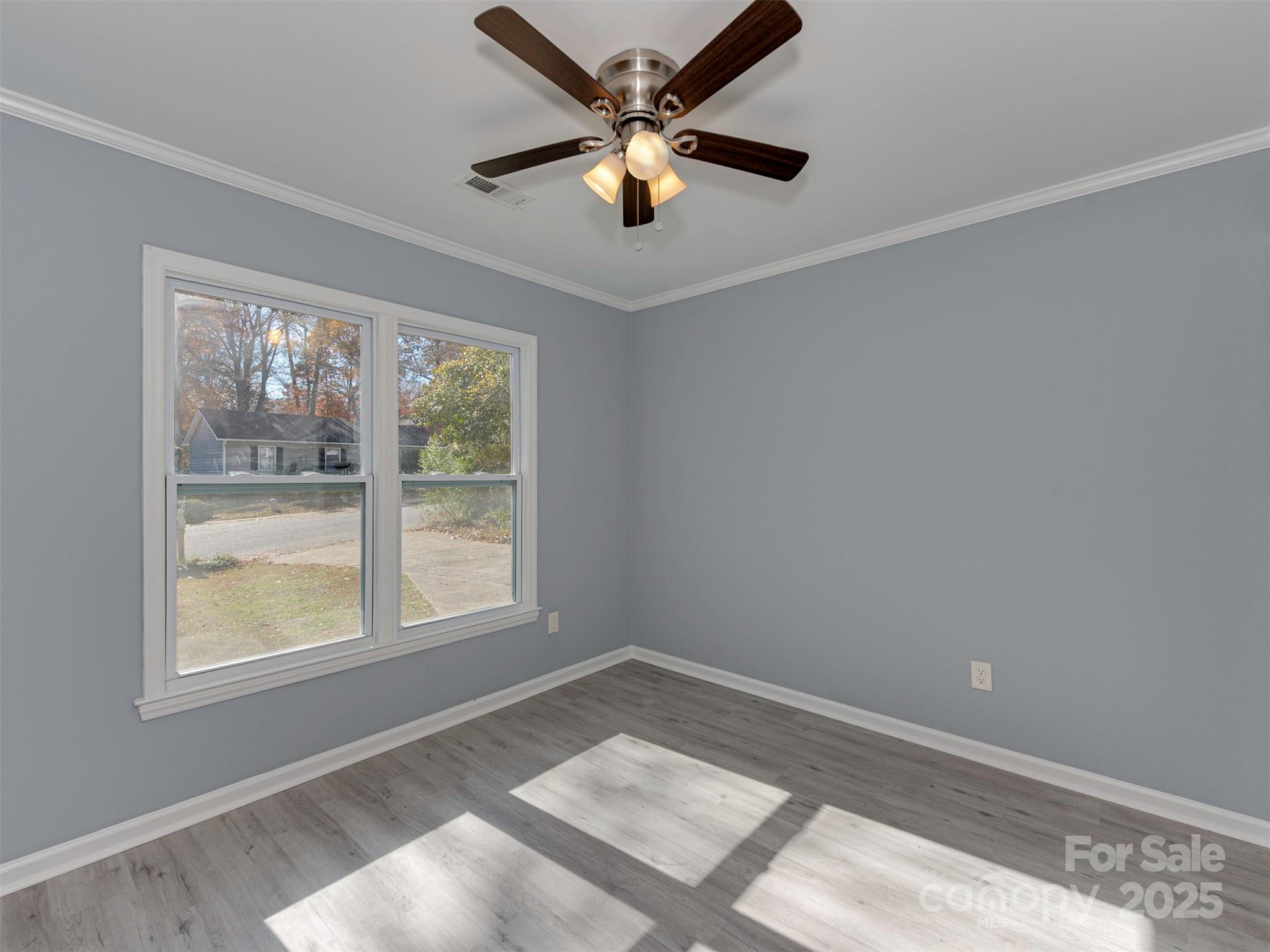 7413 Lockmont Drive Charlotte, NC 28212 - Photo 6 of 42 a view of an empty room with a window