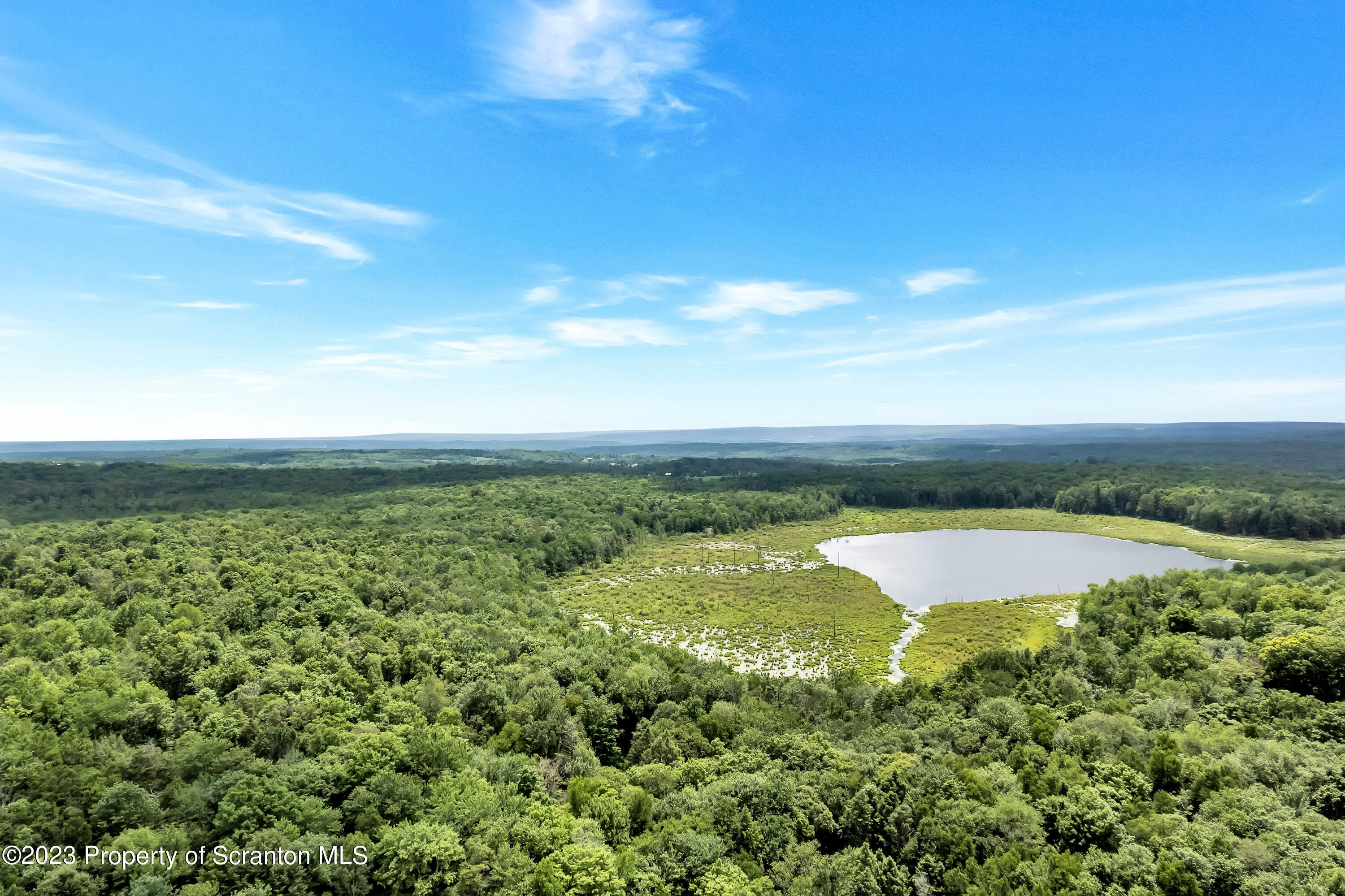 a view of a lake with a big yard