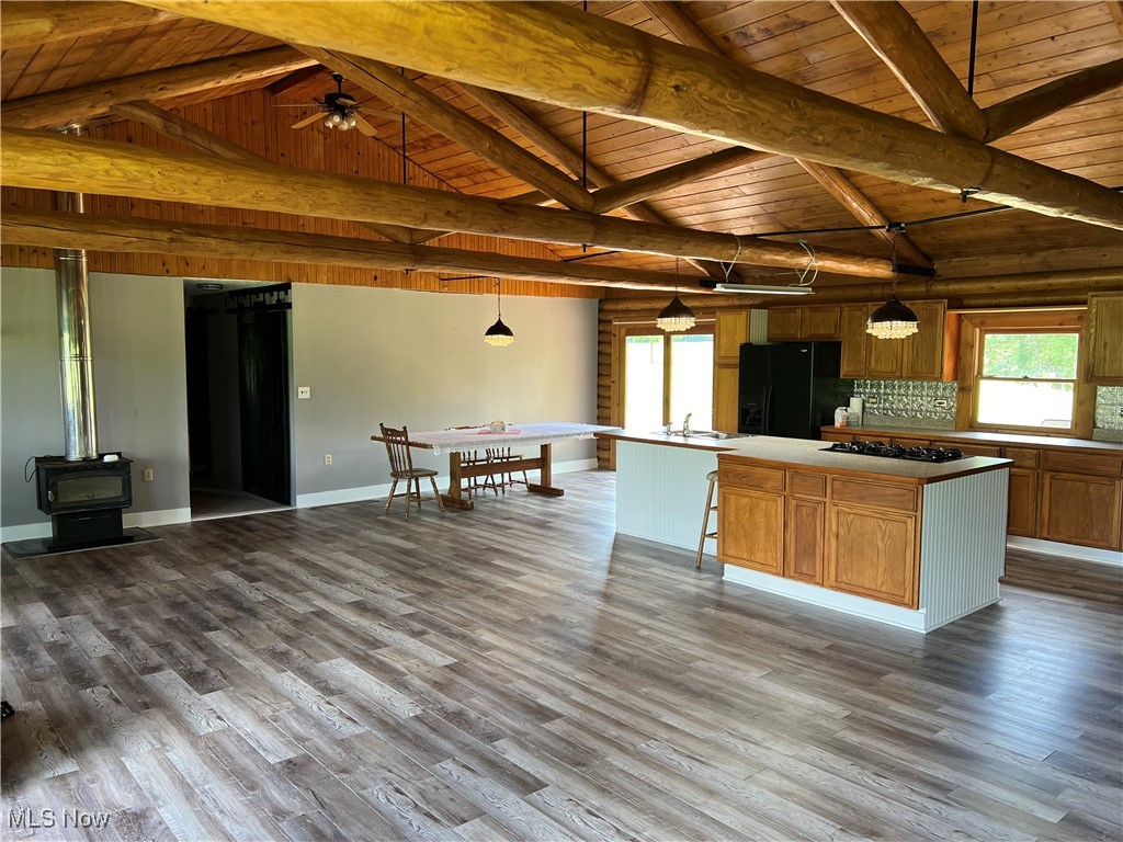 45499 Stewart Road Sullivan, OH 44880 - Photo 9 of 18 Kitchen featuring wood ceiling, pendant lighting, a center island, and black appliances