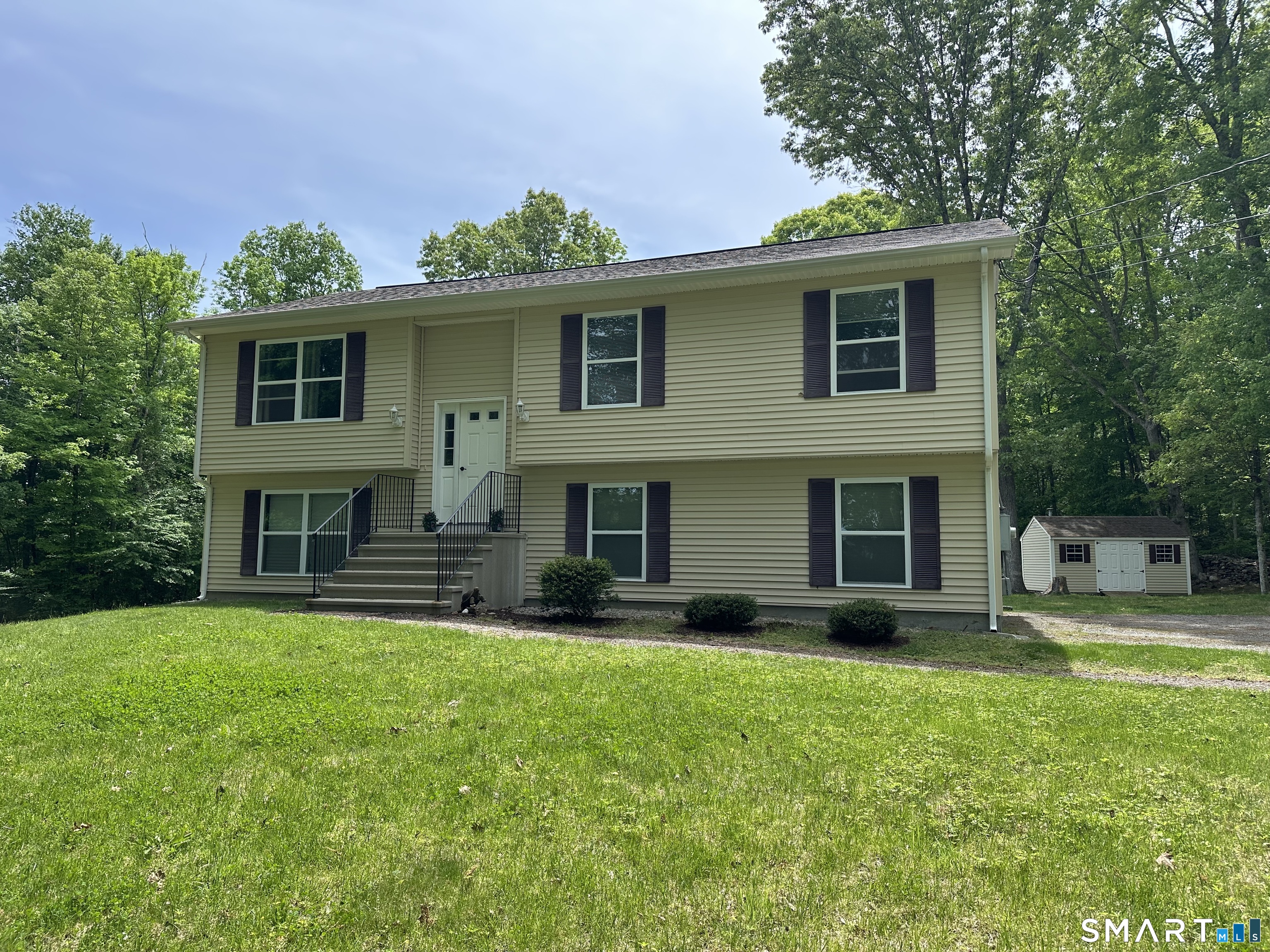 116 Tatnic Hill Road Brooklyn, CT 06234 - Photo 27 of 27 a front view of house with yard and green space