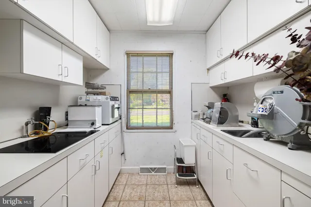 a view of a house with a yard and garage