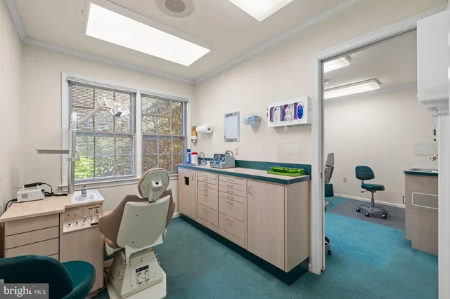 an aerial view of a house with outdoor space and street view