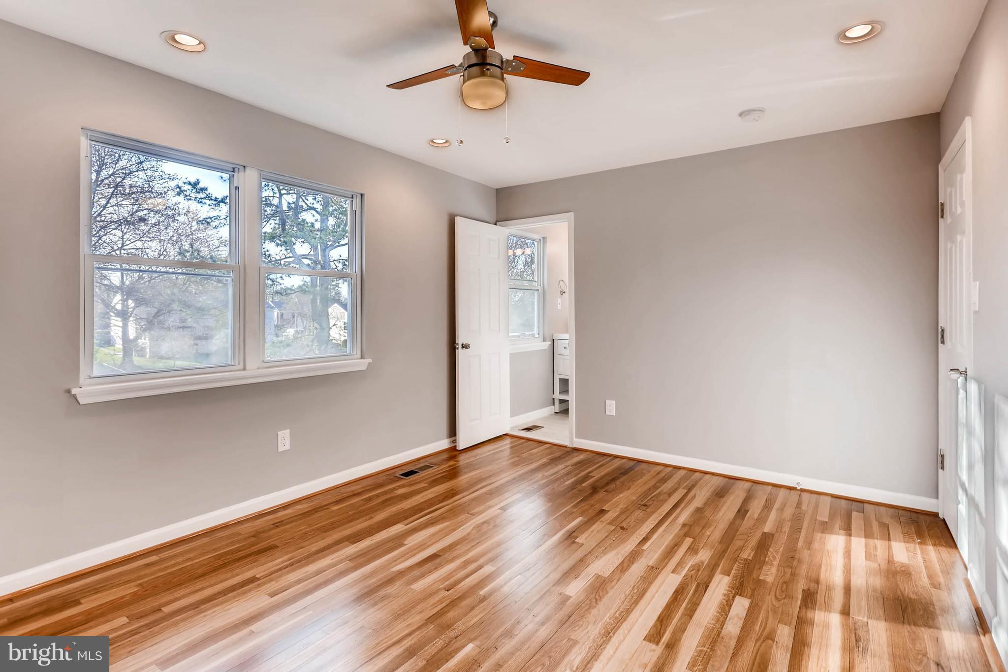 3935 Nemo Road Randallstown, MD 21133 - Photo 12 of 23 a view of empty room with wooden floor and fan